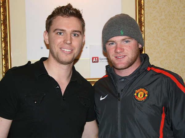 Chris Jinks with Wayne Rooney at an A1 Sporting Speakers exclusive memorabilia signing session in 2010.